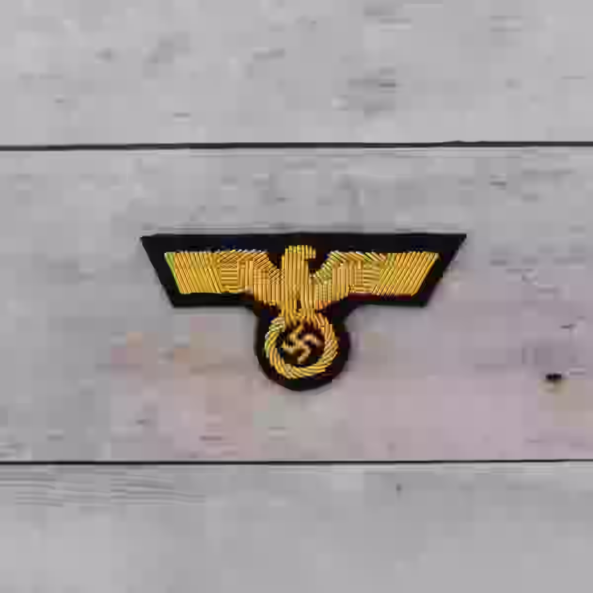 Wehrmacht Army Officer's Hand Embroidered Gold Cap Eagle - WWII-era Wehrmacht officers’ hand-embroidered cap eagle with gold aluminum wire on black wool.
