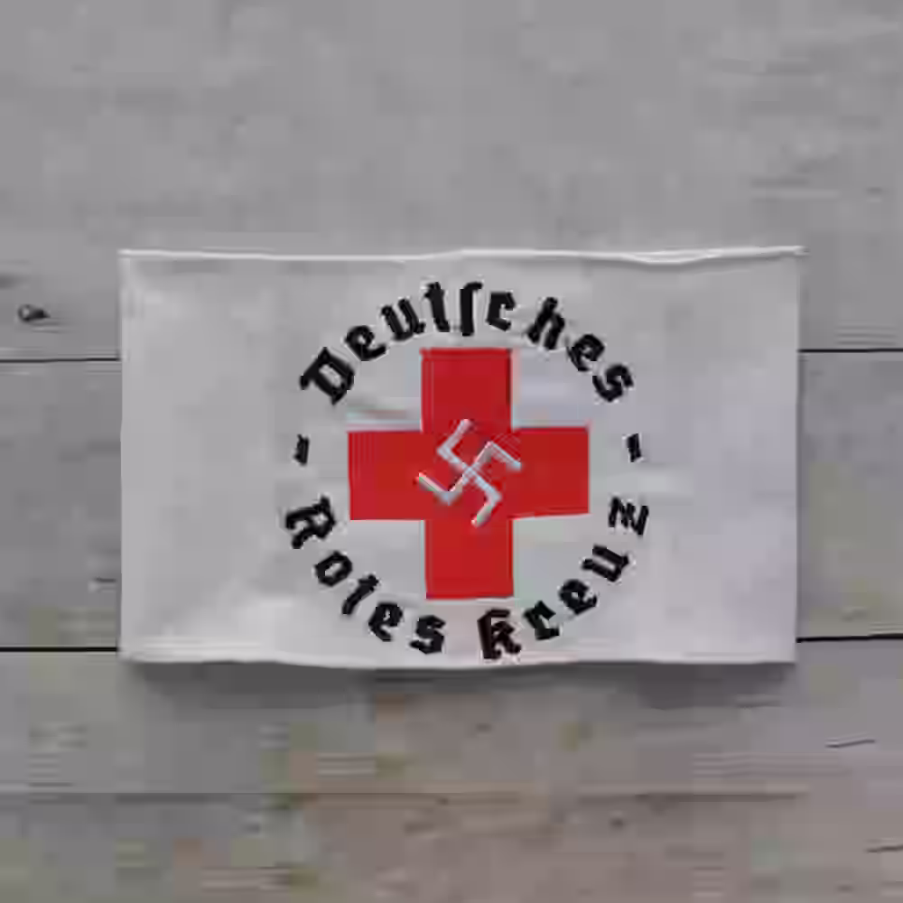 Deutsches Rotes Kreuz Armband (Swastika Design) - WWII-era Deutsches Rotes Kreuz armband with swastika and red cross on white cotton background.