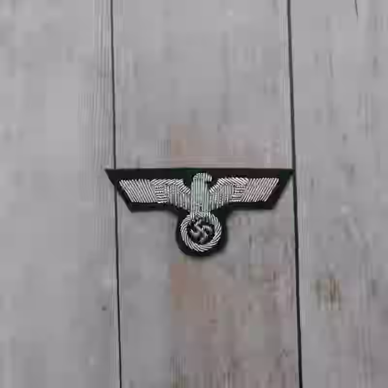 Wehrmacht Army Officer's Hand Embroidered Cap Eagle - WWII-era Wehrmacht army officers hand embroidered cap eagle with aluminum wire on dark green wool.
